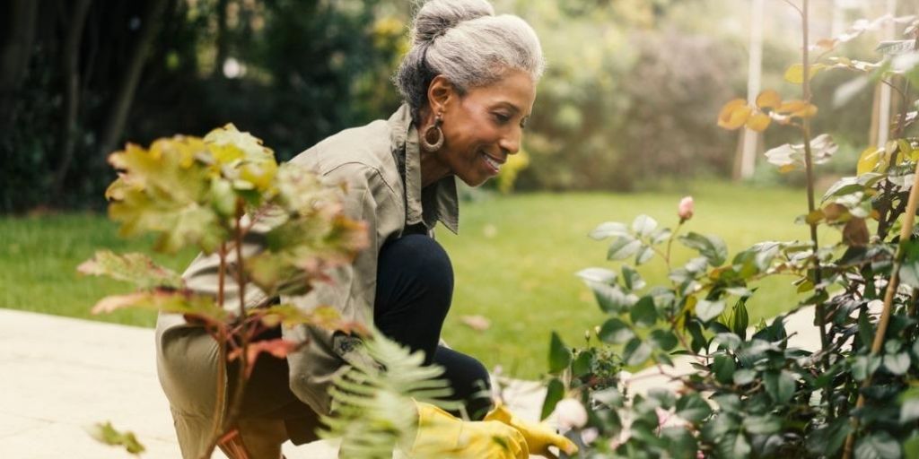 A black women gardens in retirement.