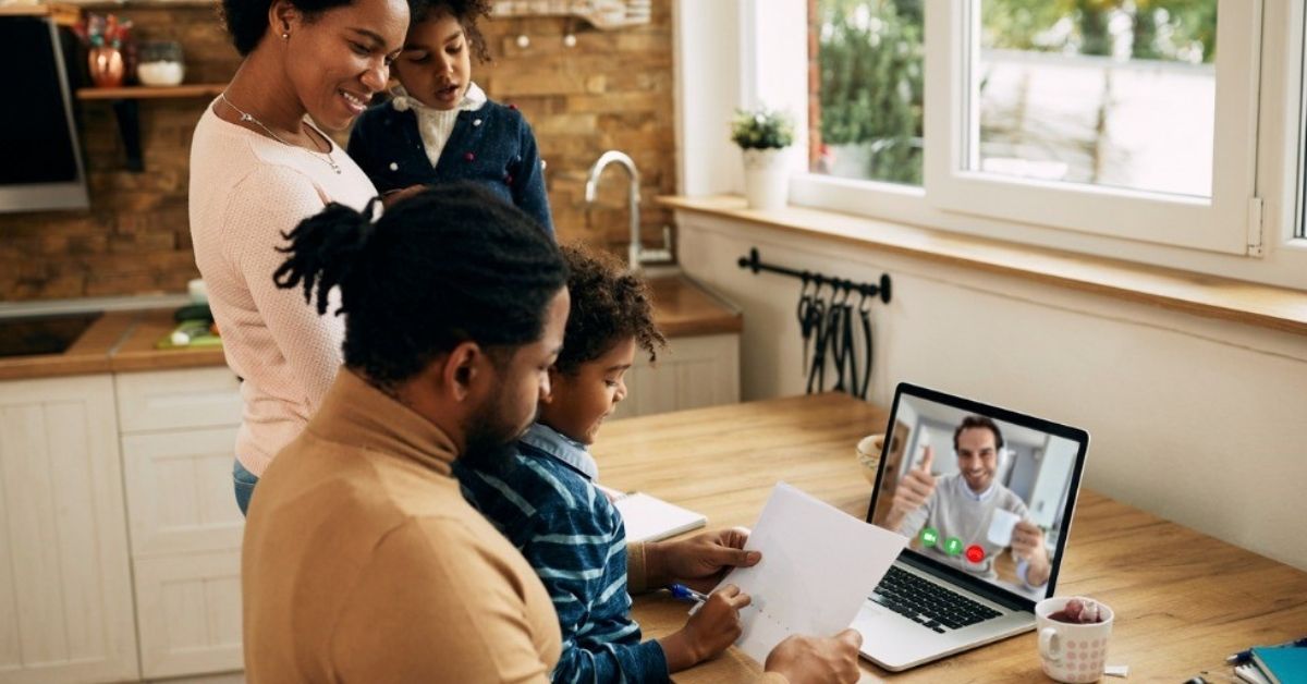 A young family meet with a financial planner over video conference