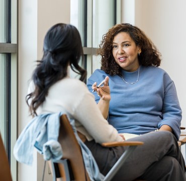 Two businesswomen having a conversation