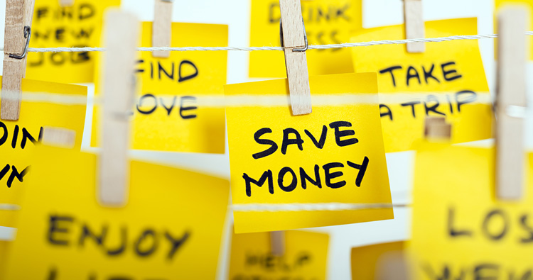An image of various yellow post-its clipped to a close-line with script writing on them.