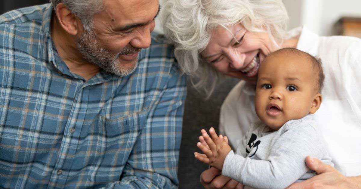 Grandparent spend time with their cute baby granddaughter