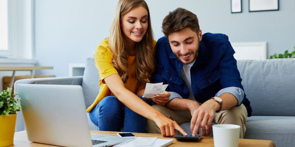 young couple review their retirement finances