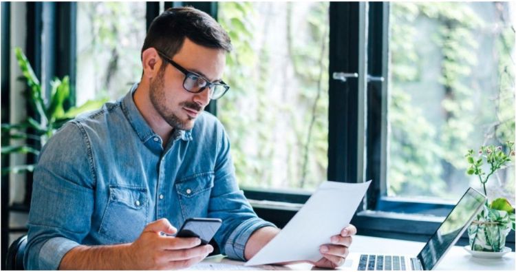 A young man works on filing a life insurance claim