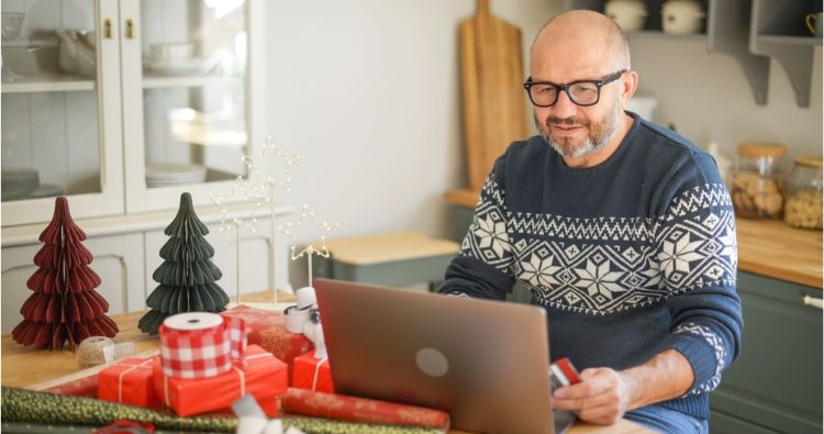 A man reviews his finances after the holidays