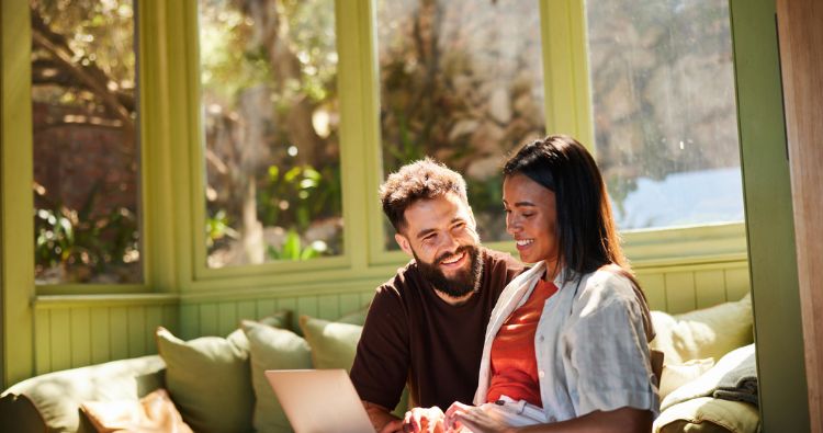 A young man and woman looking at life insurance options
