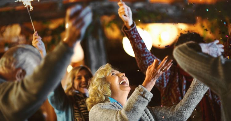 A group celebrate new years with sparklers