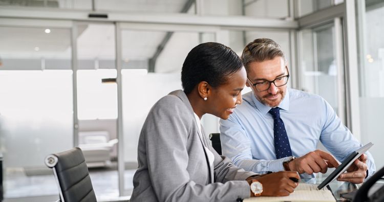 A young woman meets with her financial professional.