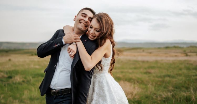 young couple getting married outside