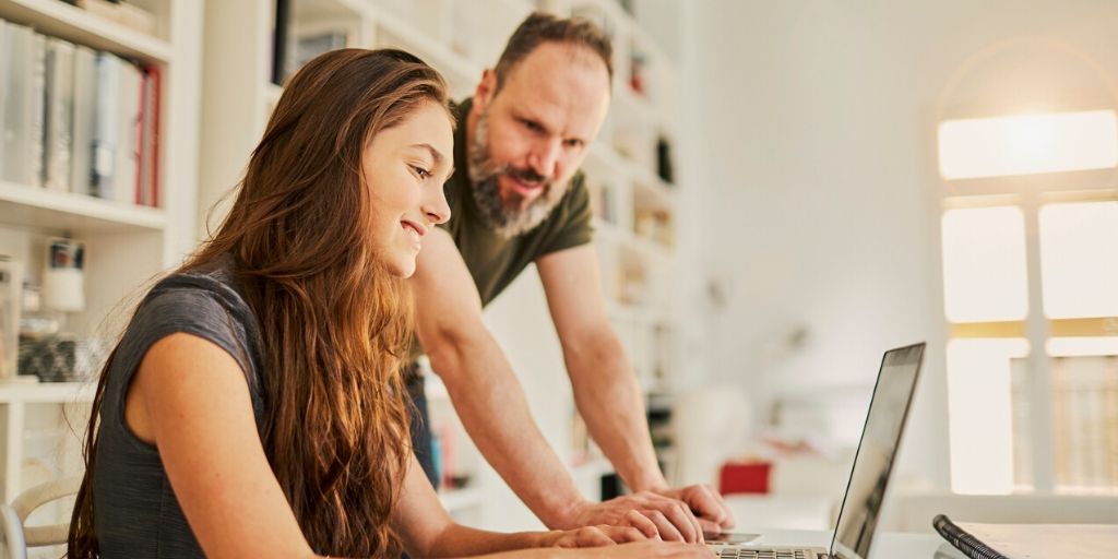 bearded dad guides teen daughter online