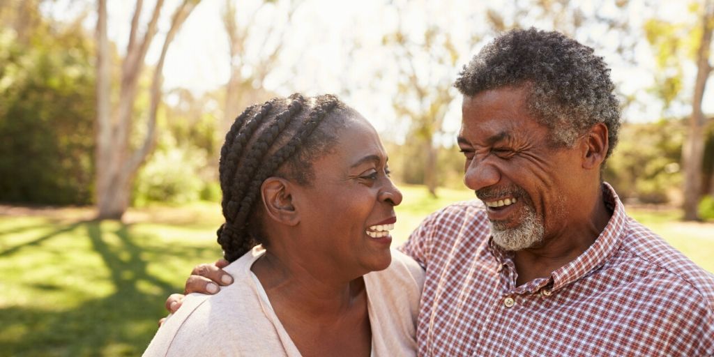 late 50s couple smiling passionately at each other