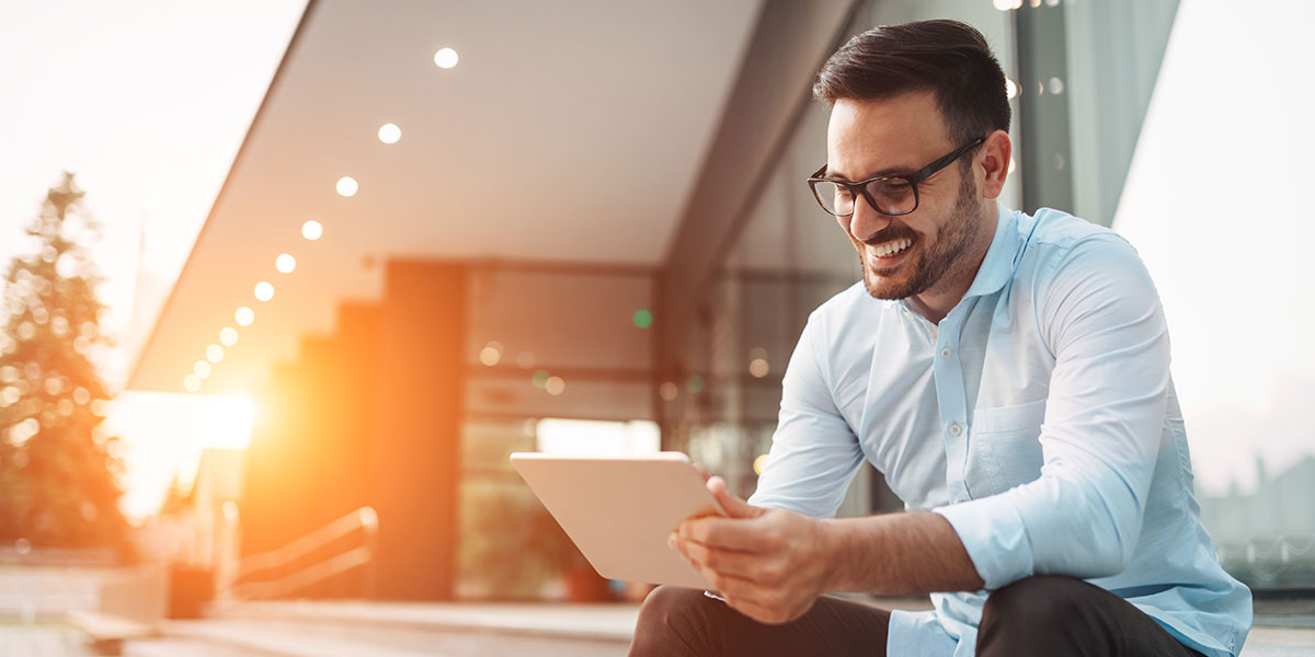 Man looking at a tablet