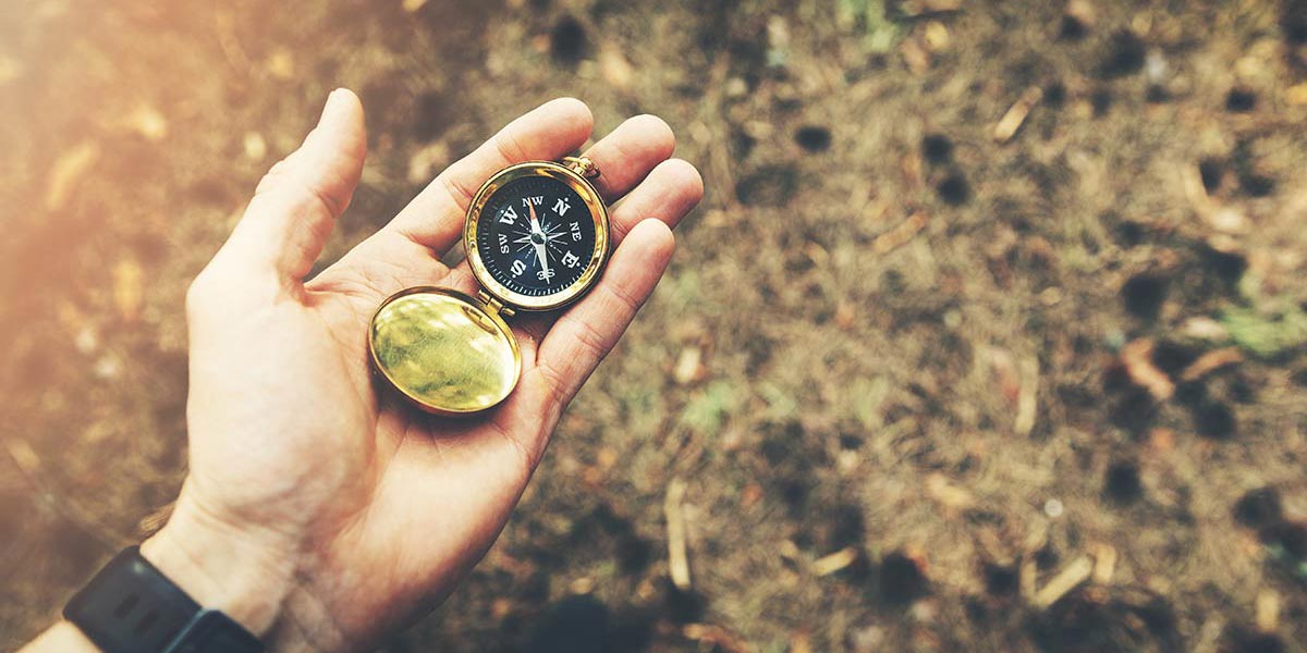 Compass in a hand