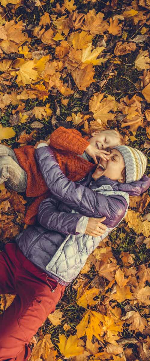 Children playing in leaves