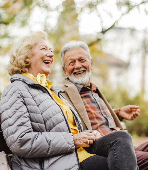 Man and a women sitting outside