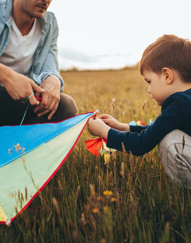 Family playing with kite